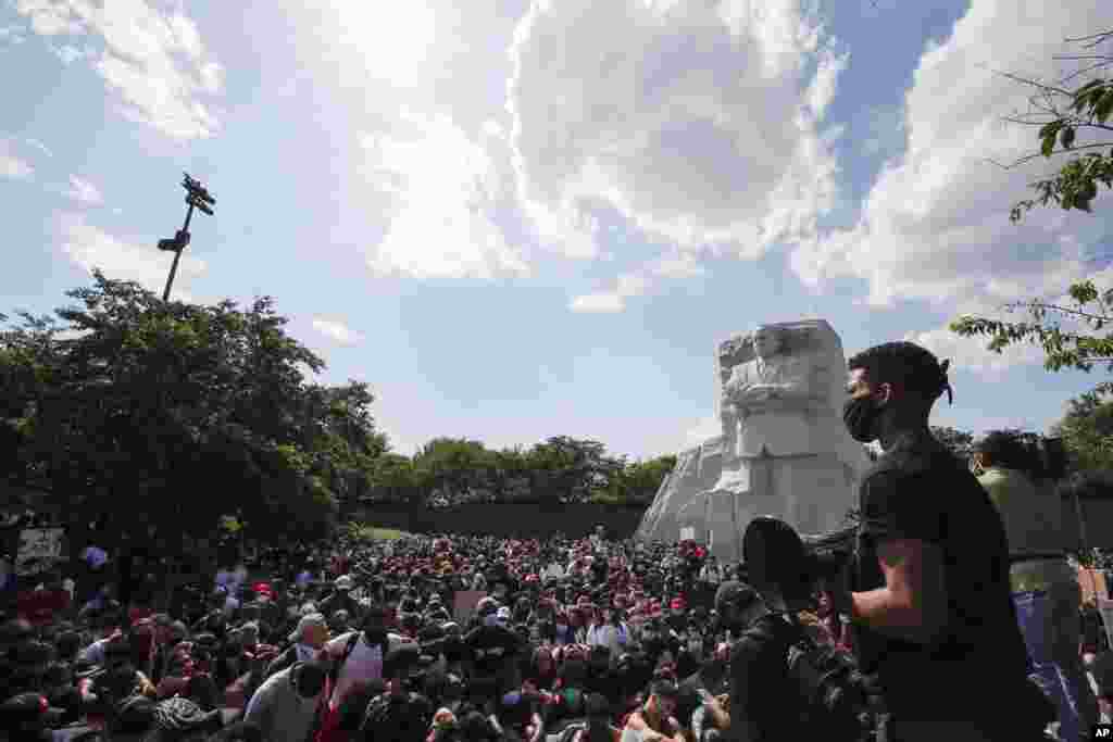 Demonstrators protest at the Martin Luther King Jr. Memorial in Washington, D.C., over the death of George Floyd, a black man held by police in Minneapolis, Minnesota. Floyd died after being restrained by police officers. (AP Photo/Alex Brandon)