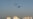 Piştî êrîşên Îranê yên bi dron û mûşekan yên 2’yê Îlona 2026’an, li ezmanê bakurê Behreynê dûman tê dîtin.