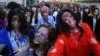 Participants wearing zombie makeup perform during a Halloween event at Tokyo Tower in Tokyo, Oct. 31, 2013. 