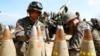 FILE - South Korean army soldiers arrange 155 mm howitzer shells during a military exercise in Goseong, South Korea, on April 4, 2016.