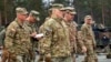 In this image provided by the U.S. Army, U.S. Chairman of the Joint Chiefs of Staff Gen. Mark Milley meets with U.S. Army leaders at Grafenwoehr Training Area, Grafenwoehr, Germany, Jan. 16, 2023. 
