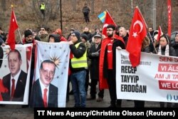 Members of pro-Turkish organization Union of European Turkish Democrats (UETD) demonstrate in support of Turkey and President Recep Tayyip Erdogan outside the Turkish embassy in Stockholm, Sweden, Jan. 21, 2023.