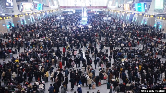 Travelers wait for trains at Hangzhou East railway station during the Spring Festival travel rush ahead of the Chinese Lunar New Year, in Hangzhou, Zhejiang province, China, Jan. 20, 2023.