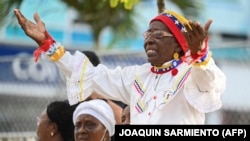 (FILE) A woman at an event where Columbian President Gustavo Petro presented the progress of the local peace process in Buenaventura, Columbia. 