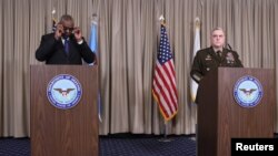 U.S. Secretary of Defense Lloyd Austin and U.S. Chairman of the Joint Chiefs of Staff Gen. Mark A. Milley hold a news conference at Ramstein Air Base, Germany, Jan. 20, 2023. 