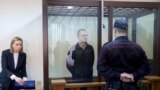 FILE - Journalist Andrzej Poczobut, center, stands in a defendants' cage during a court session in Grodno, Belarus, Jan. 16, 2023. Belarus' Supreme Court upheld an eight-year prison sentence against Poczobut on May 26, 2023.