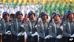 FILE - Police march during a ceremony marking Myanmar's 75th anniversary of Independence Day in Naypyitaw, Myanmar, Jan. 4, 2023. 