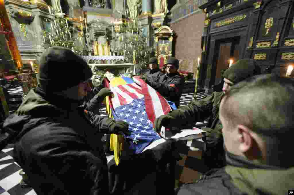 Ukrainians soldiers participate in the farewell ceremony for U.S. citizen Daniel W. Swift in Lviv. The former U.S. Navy SEAL went AWOL in 2019, and was killed last week in Ukraine during fighting with the Russian army.