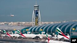 In this file photo, an Emirates jetliner comes in for landing at Dubai International Airport in Dubai, United Arab Emirates, Dec. 11, 2019. (AP Photo/Jon Gambrell, File)