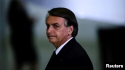 FILE - Brazil's then-President Jair Bolsonaro looks on after a ceremony at the Planalto Palace in Brasilia, Brazil, June 20, 2022. 