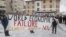 Climate activists display a banner during a protest ahead of the World Economic Forum (WEF) 2023 in the Alpine resort of Davos, Switzerland, Jan. 5, 2023. 