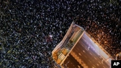Tens of thousands of Israelis protest against the plans by Prime Minister Benjamin Netanyahu's new government to overhaul the judicial system, in Tel Aviv, Israel, Jan. 21, 2023.