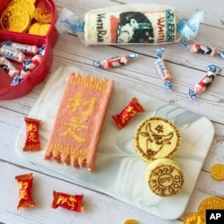 This undated photo provided by Sue Ng shows a chiffon cake modeled after a popular Chinese red candy made by Ng in her home for Lunar New Year in Hong Kong.