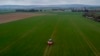 FILE - A farmer fertilizes a field on the outskirts of Frankfurt, Germany, April 4, 2022. Russia's war in Ukraine pushed up fertilizer prices but they have come down since their peak in mid-2022.