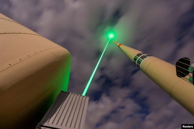 The Laser Lightning Rod is seen in action at the top of Mount Santis in Switzerland in this undated photograph. (TRUMPF/Martin Stollberg/Handout via REUTERS)