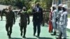 In this handout photo, US Defense Secretary Lloyd Austin III, right, walks with Western Mindanao Commander Lt. Gen. Roy Galido, left, as he arrives Camp Don Basilio Navarro in Zamboanga province, southern Philippines, Feb. 1, 2023.