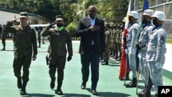 In this handout photo, US Defense Secretary Lloyd Austin III, right, walks with Western Mindanao Commander Lt. Gen. Roy Galido, left, as he arrives Camp Don Basilio Navarro in Zamboanga province, southern Philippines, Feb. 1, 2023.