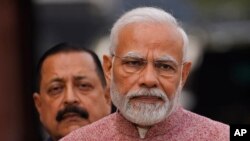 FILE - Indian Prime Minister Narendra Modi, center, addresses the media on the opening day of the winter session of the Parliament, in New Delhi, India, Dec. 7, 2022. 