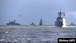 资料照：中共官媒新华社发布照片显示中俄海军在东中国海举行联合军演。（2022年12月27日）