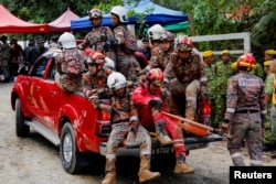 Rescue crews arrive to aid in search for victims of the landslide in Batang Kali, Selangor state, Malaysia, Dec.16, 2022.