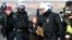 Police officers carry Swedish climate activist Greta Thunberg away from the edge of the Garzweiler II opencast lignite mine during a protest by climate activists after the clearance of Luetzerath, Germany, Jan. 17, 2023. 