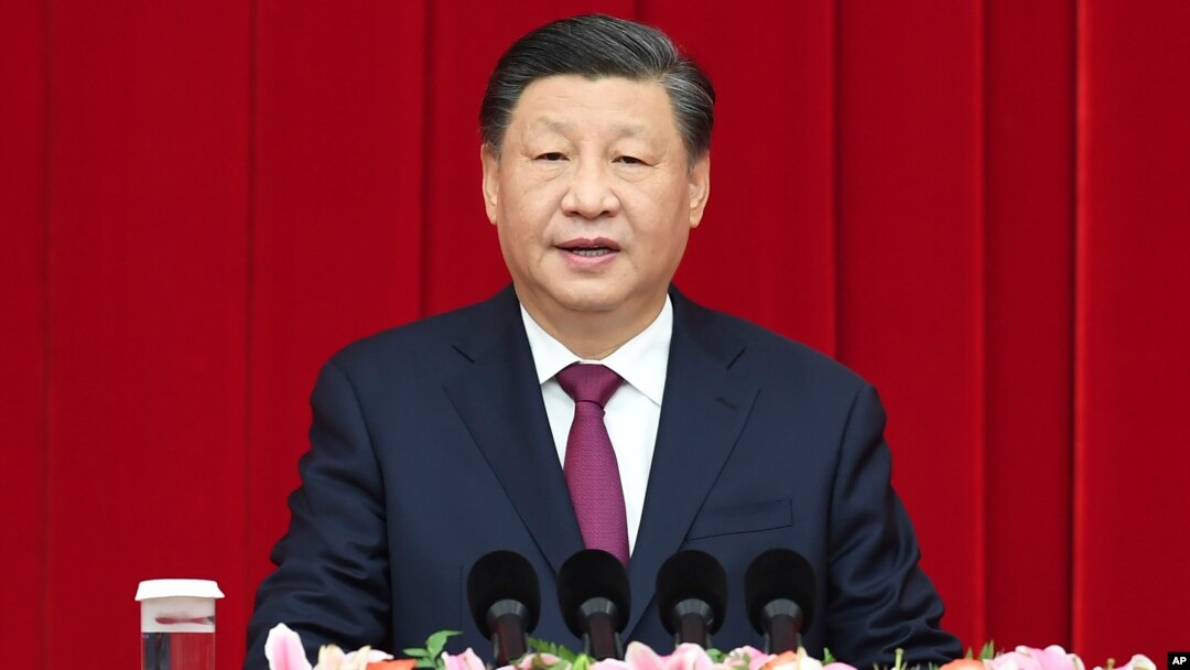 FILE - In this photo released by Xinhua News Agency, Chinese President Xi Jinping speaks during the New Year gathering organized by the National Committee of the Chinese People's Political Consultative Conference in Beijing on Dec. 30, 2022. 