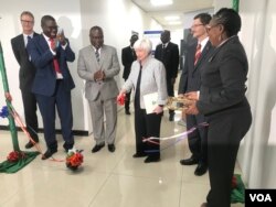 U.S. Treasury Secretary Janet Yellen cuts the ribbon at the launch of the Zambia National Public Health Institute offices in Lusaka, Jan. 23, 2023. (Kathy Short/VOA)