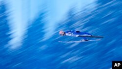 Dawid Kubacki of Poland soars through the air during his qualification jump at the Ski Flying World Cup in Bad Mitterndorf, Austria.