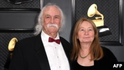 FILE - David Crosby and his wife, Jan Dance, arrive for the 62nd Annual Grammy Awards in Los Angeles, Jan. 26, 2020. Crosby, an influential folk-rock musician of the 1960s and 1970s, has died at 81, media reported on Jan. 19, 2023.