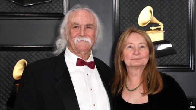 FILE - David Crosby and his wife, Jan Dance, arrive for the 62nd Annual Grammy Awards in Los Angeles, Jan. 26, 2020. Crosby, an influential folk-rock musician of the 1960s and 1970s, has died at 81, media reported on Jan. 19, 2023.