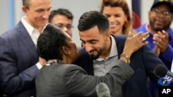 U.S. Representative Sheila Jackson Lee of Texas hugs Abdul Wasi Safi during a news conference in Houston, Texas, Jan. 27, 2023.