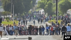 Demonstrators block the San Isidro bridge at the entrance to Arequipa, Peru, during protests to call for the resignation of President Dina Boluarte, on Jan. 19, 2023.