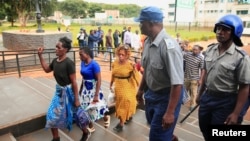 Opposition party Citizens Coalition for Change supporters arrive at the magistrate court for a bail hearing after they were arrested for unlawful gathering with intent to incite public violence in Harare, Zimbabwe, Jan. 16, 2023. 