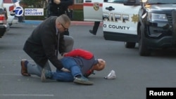A suspect is arrested by law enforcement personnel after a mass shooting at two locations in the coastal northern California city of Half Moon Bay, California, U.S. January 23, 2023 in a still image from video. (ABC Affiliate KGO via REUTERS)
