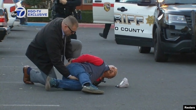 A suspect is arrested by law enforcement personnel after a mass shooting at two locations in the coastal northern California city of Half Moon Bay, California, U.S. January 23, 2023 in a still image from video. (ABC Affiliate KGO via REUTERS)