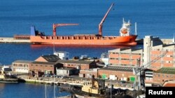 FILE - Container carrier 'Lady R' docks at Simon's Town Naval Base, in Cape Town, South Africa. Taken Dec. 7, 2022. 