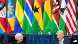 FILE - US President Joe Biden listens as Treasury Secretary Janet Yellen, left, speaks during the closing session at the U.S.-Africa Leaders Summit on promoting food security and food systems resilience in Washington, Dec. 15, 2022.