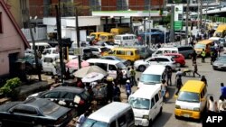 FILE: Drivers wait in line to buy fuel at and next to a filling station, causing traffic gridlock at Obalende in Lagos on January 30, 2023. - Nigerians continue to express hardship caused by ongoing fuel scarcity across the country, which is slowing economic activities.