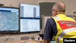 A member of the Incident Management Team coordinates the search for a radioactive capsule that was lost in transit, at the Emergency Services Complex in Cockburn, Australia, in this undated handout photo. (Department of Fire and Emergency Services/Handout via Reuters) 