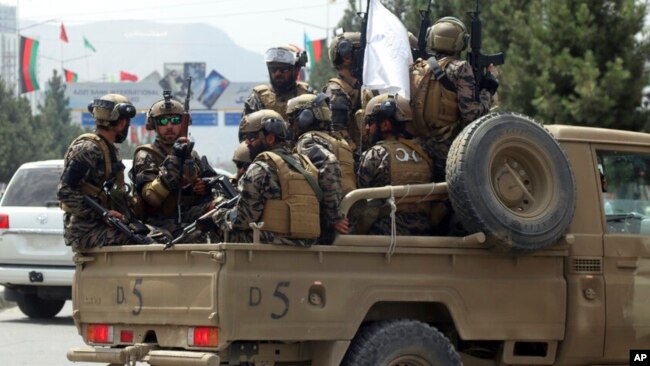 FILE - Taliban special forces arrive at Kabul's airport, Aug. 31, 2021. A 2022 Pentagon report confirmed that the fall of the Afghan government gave the Taliban access to more than $7 billion worth of U.S. military equipment.