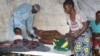 Medical staff takes care of a cholera patient inside a cholera ward in Blantyre, Malawi. (Lameck Masina/VOA)