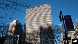 FILE - The Jacob K. Javits Federal Office Building, center, also known as 26 Federal Plaza, is seen in New York City, Jan. 9, 2020. Among others, it houses offices of the FBI.