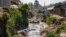FILE: A tributary full of garbage, which feeds into the Nairobi River, flows through the informal settlement of Kibera in Nairobi, Kenya is noted on World Water Day, March 22.. Taken Wed, Jan. 11, 2023.