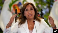 FILE - Peru's President Dina Boluarte gives a press conference with foreign media at the government palace in Lima, Jan. 24, 2023.