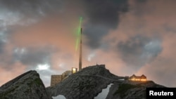 The Laser Lightning Rod is seen in action at the top of Mount Santis in Switzerland. (TRUMPF/Martin Stollberg/Handout via REUTERS)