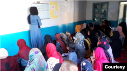 In SRAK’s underground school in Kabul, volunteers teach Afghan girls English, math, sciences and other subjects. (Photo courtesy SRAK)