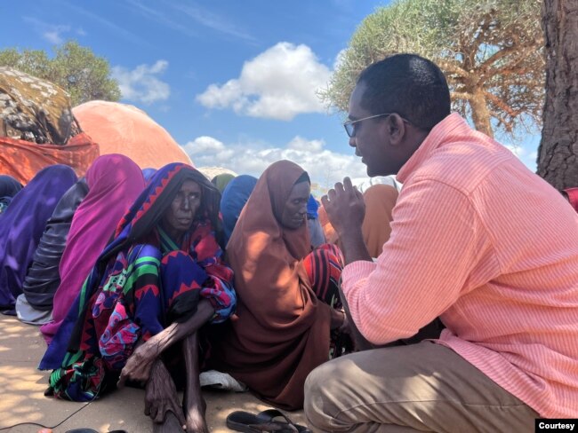 Somali journalist Abdalle Ahmed Mumin is seen out on assignment in Somalia. (Courtesy - Abdalle Ahmed Mumin)