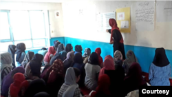 In SRAK’s underground school in Kabul, volunteers teach Afghan girls English, math, sciences and other subjects. (Photo courtesy SRAK)