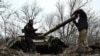 Ukrainian service members check a tank barrel during offensive and assault drills, amid Russia's attack on Ukraine, in Zaporizhzhia Region, Ukraine, Jan. 23, 2023. 