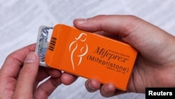 FILE - A pack of Mifeprex pills, used to terminate early pregnancies, is displayed in this picture illustration taken on May 11, 2022. 